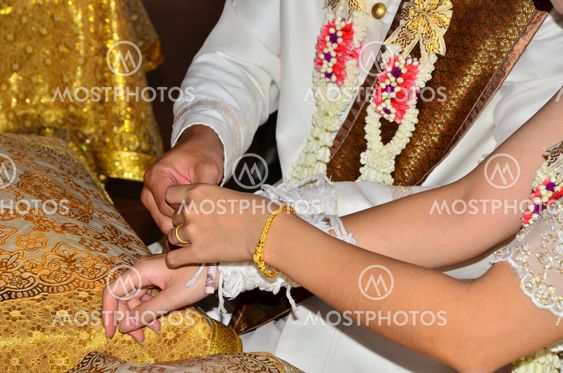 bride and groom holding hands
