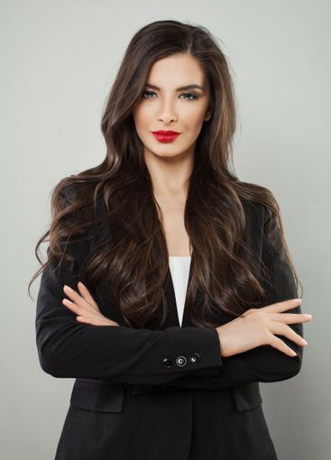 Successful business woman brunette looking at camera,...