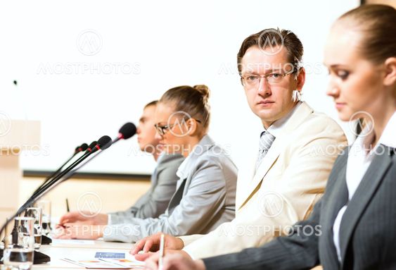 businessmen communicate at the conference