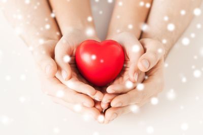 woman and man hands with heart