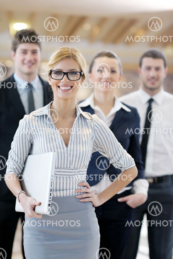 business woman standing with her staff at conference