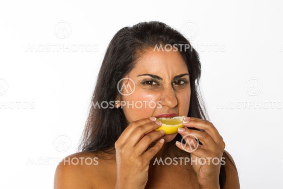 Indian Woman Eats Lemon