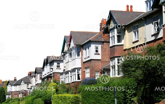 Row of modern houses in street isolated on white