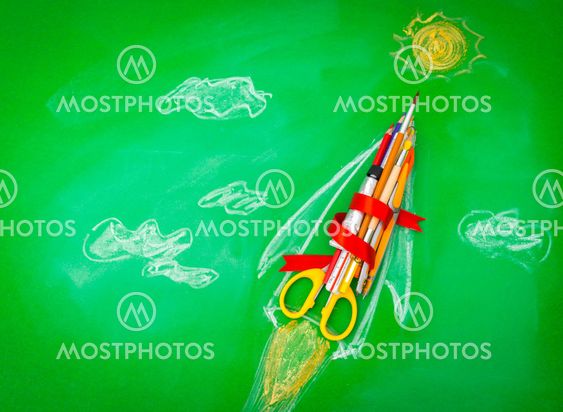 Rocket made from School supplies on Green chalkboard "...