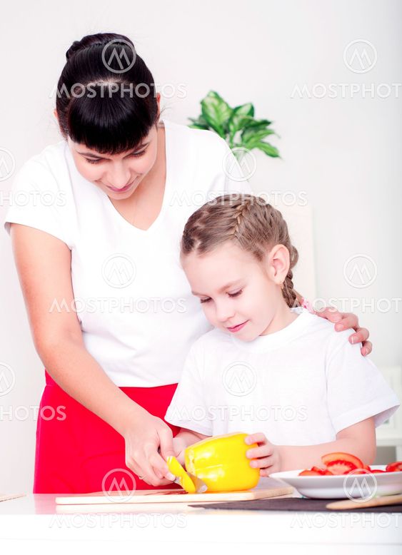mom and daughter cooking together