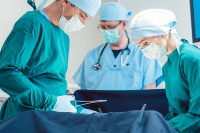 Surgical doctor in full concentration on operation