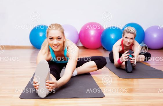 Two stretching girls
