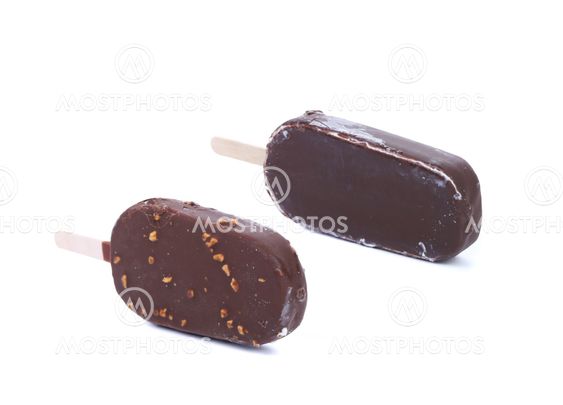 Two chocolate-coated blocks of ice cream on stick.