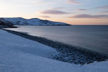 View of Dragon Eggs Beach on a March evening. Teriberka