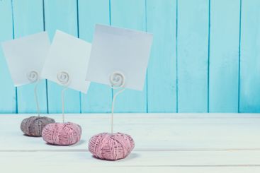 Cute home decor card holders on blue wooden background