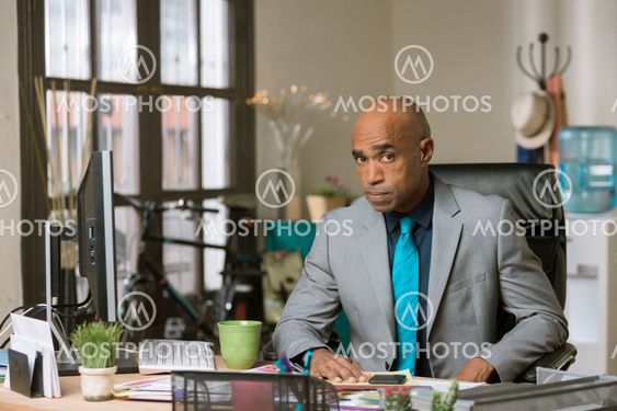 Skeptical Man in a Creative Office