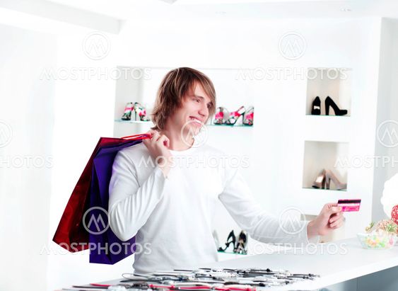 man at shopping checkout paying credit card
