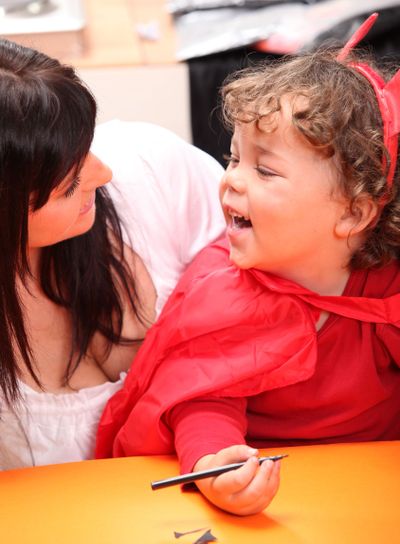 Mother sharing a moment with her daughter on Halloween