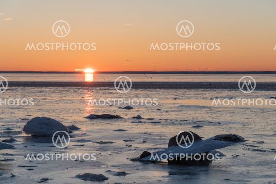 Sunset view by an icy coast
