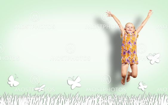 Girl jumping in a color dress
