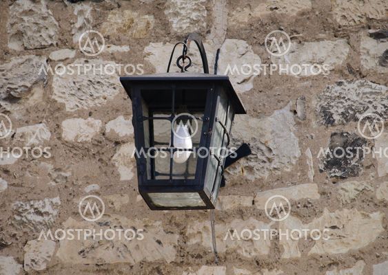 Lamp on building wall