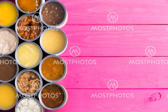 Open Cans of Soup on Bright Pink Background