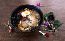Ramen asiatic bowl on a wooden table