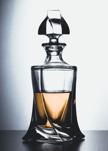 Strong alcoholic drink in glass close up