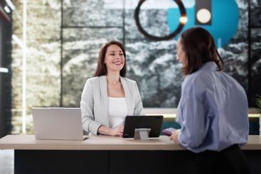 Traveling Businesswoman Arranging Check-in