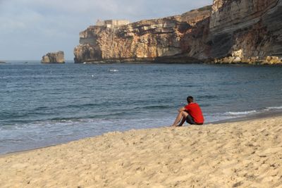 Man sitting on the seacoast