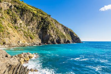Rocky coast in Riomaggiore on the Mediterranean in Italy