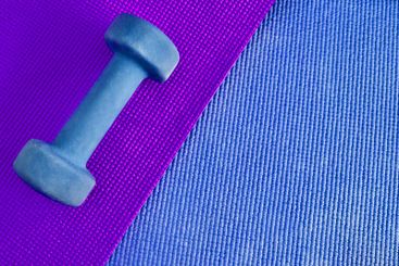 Dumbbell, fitness and weightlifting on colourful...