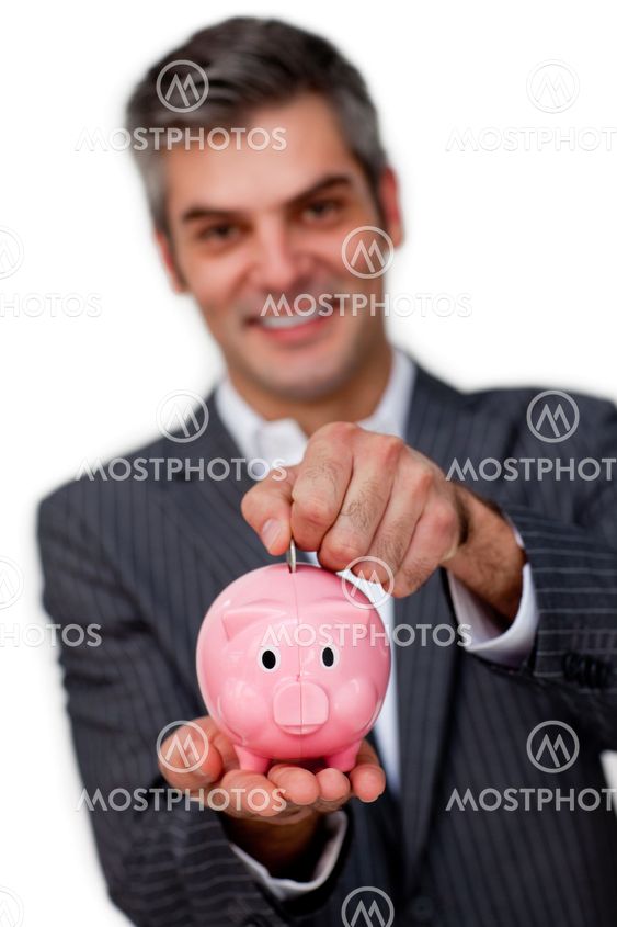 Businessman saving money in a piggybank
