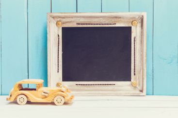 Cozy pastel wooden home decor objects on blue background