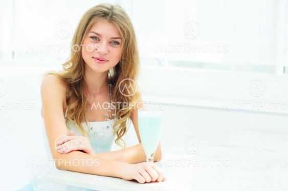 Portrait of a cute woman in a city cafe
