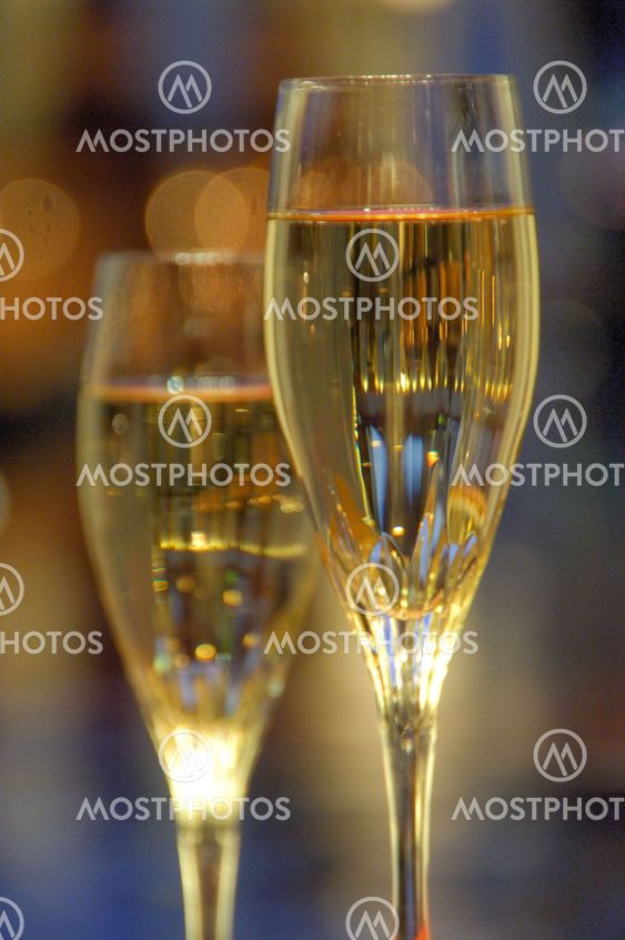 a pair of glasses of champagne