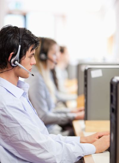 Portrait of young operators using a computer