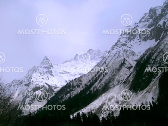 Mountain under the blue sky and the clouds