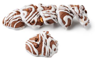 Chocolate cookies with icing arranged artfully on a...