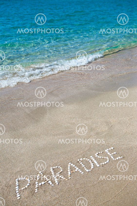Paradise written on the sand