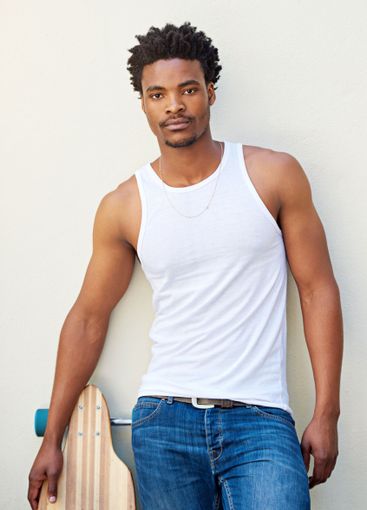 Portrait, serious and man with skateboard, wall and guy...