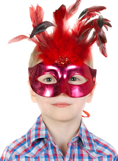 The Boy in the masquerade mask with feathers