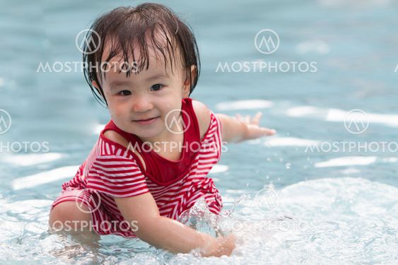 Chinese Little Girl Playing in Water