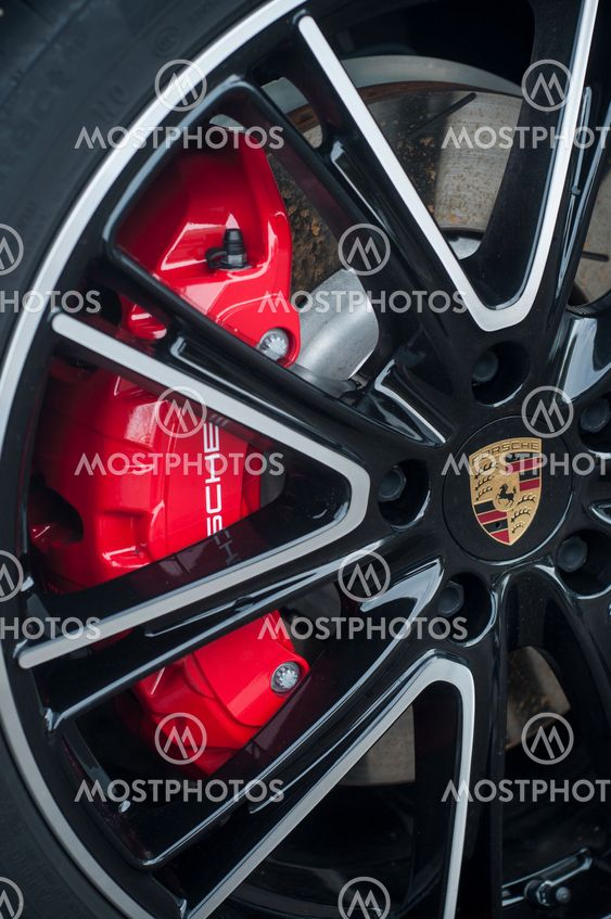 red break on wheel of Porsche sport car