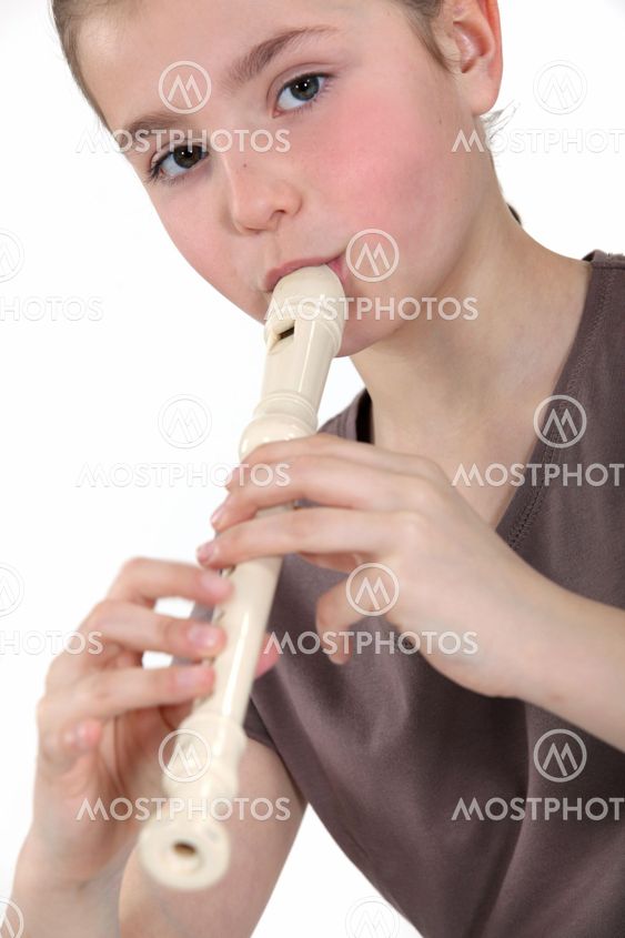 childgirl playing flute