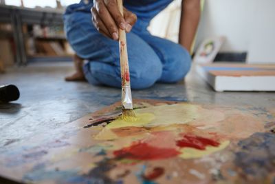 Artist woman, painting and paint brush on art studio...