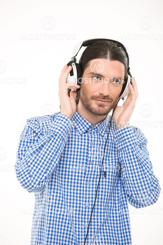 Handsome young man listening to music