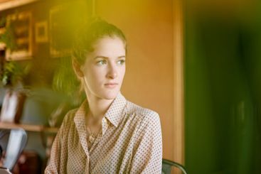 Coffee shop, remote work and thinking with woman...