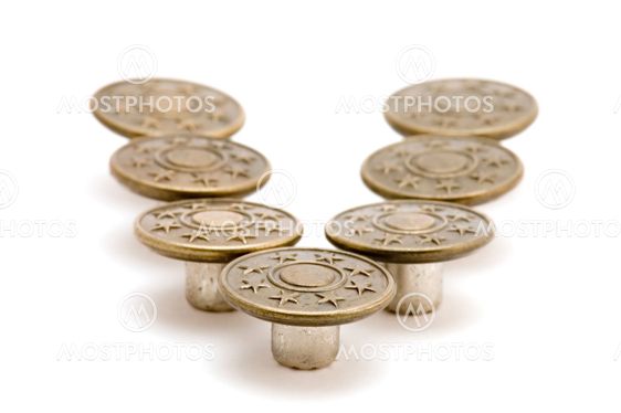 Metal button on white