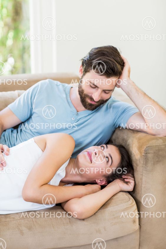 Young couple relaxing on sofa
