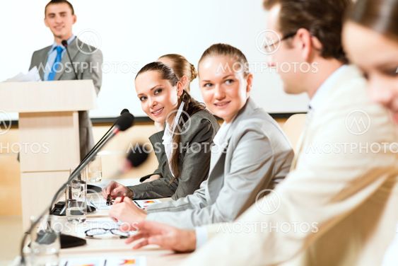 businessmen communicate at the conference