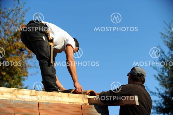 Roofers at work