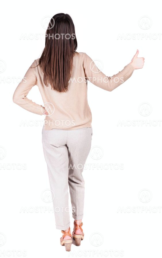 Back view of woman thumbs up.