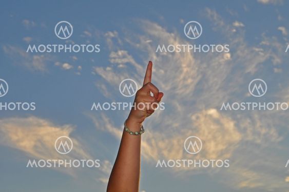 Hand pointing to sky