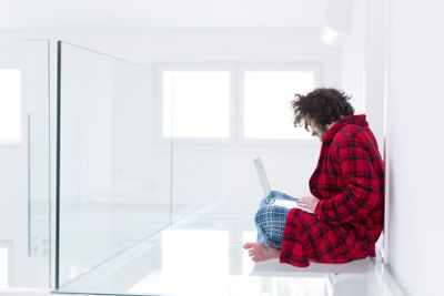 young freelancer in bathrobe working from home